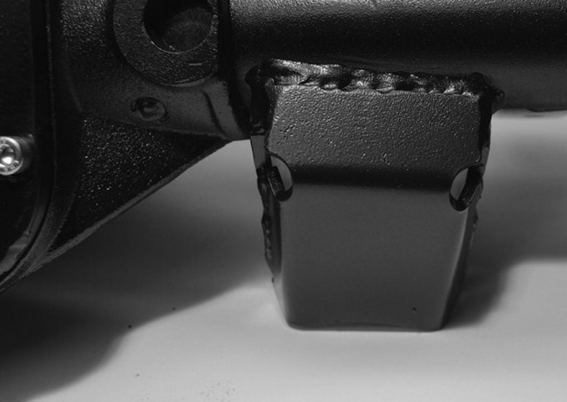 Front arm lower bracket skid